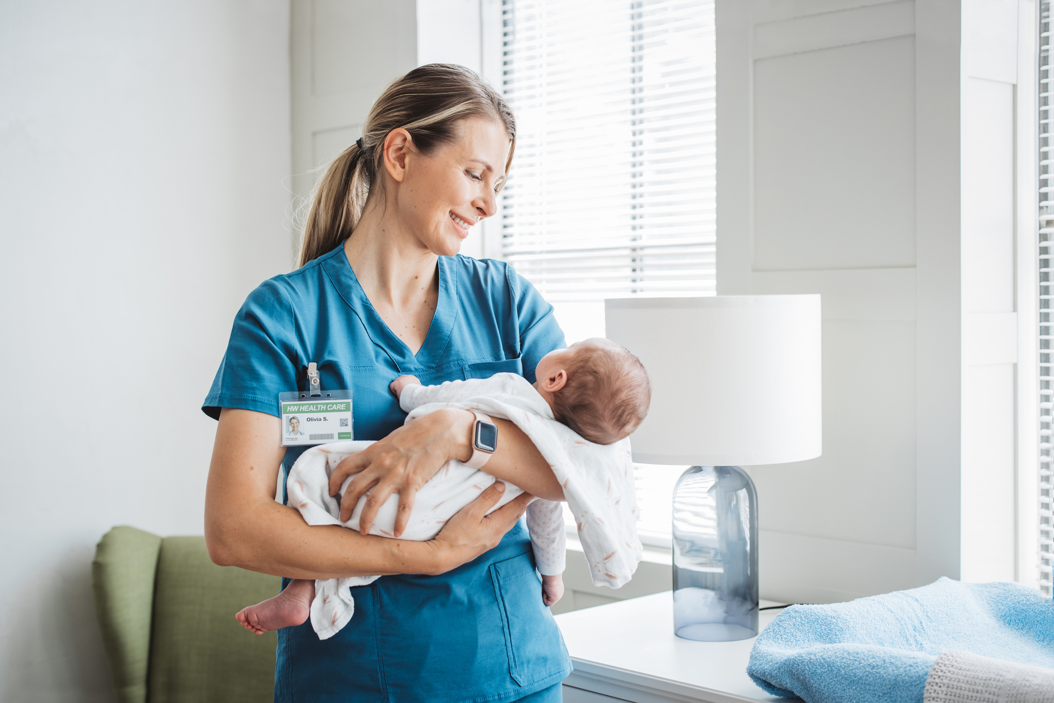 maternal-nurse-holding-baby