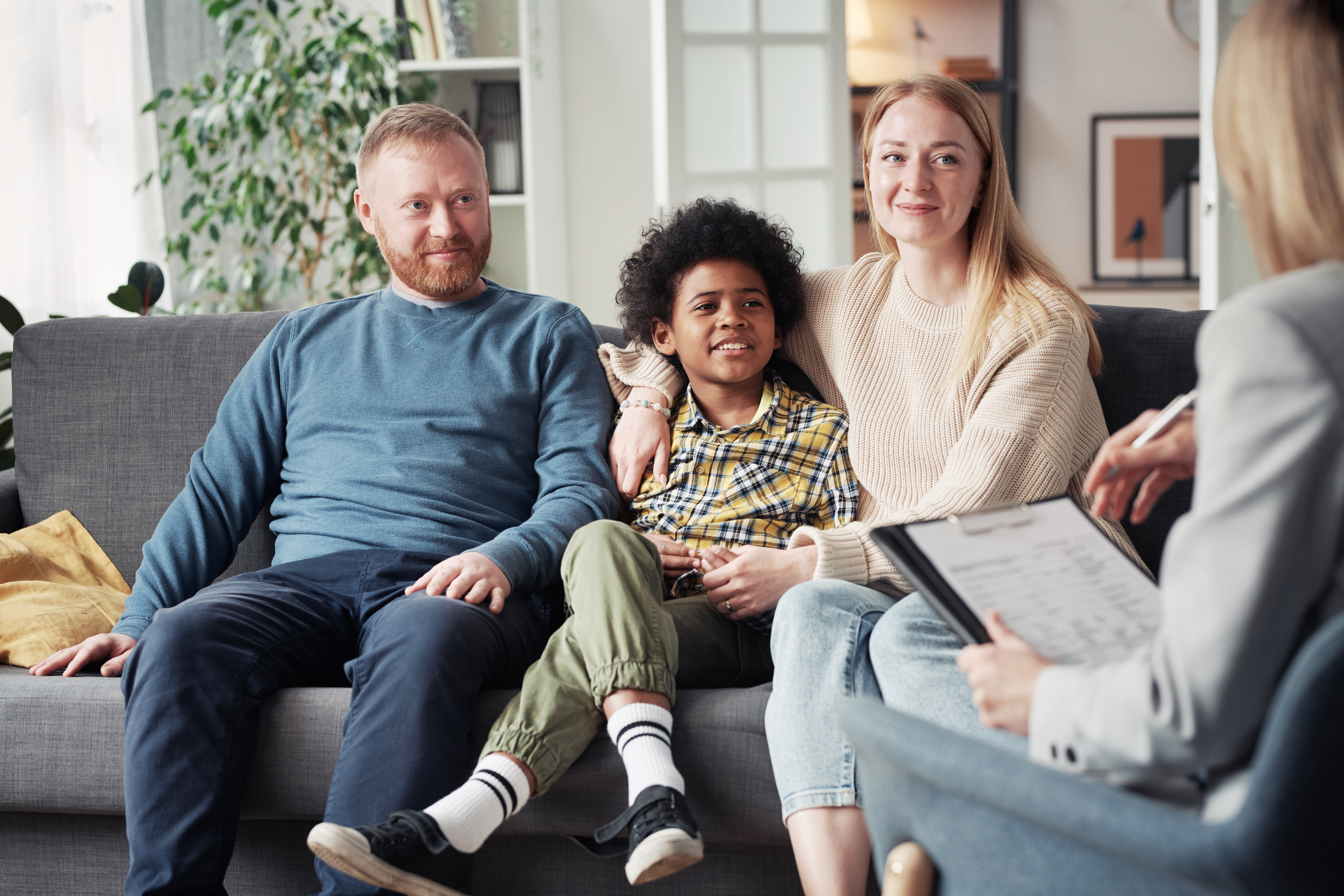 social-worker-woman-talking-and-working-with-diverse-family