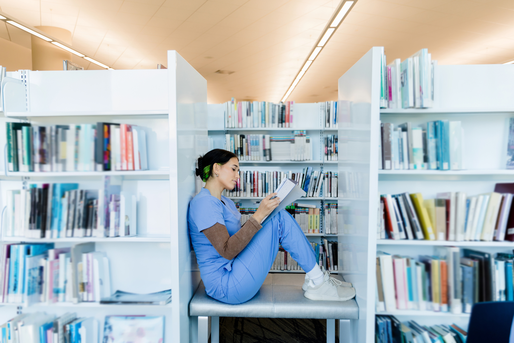 healthcare-worker-reading-in-a-library