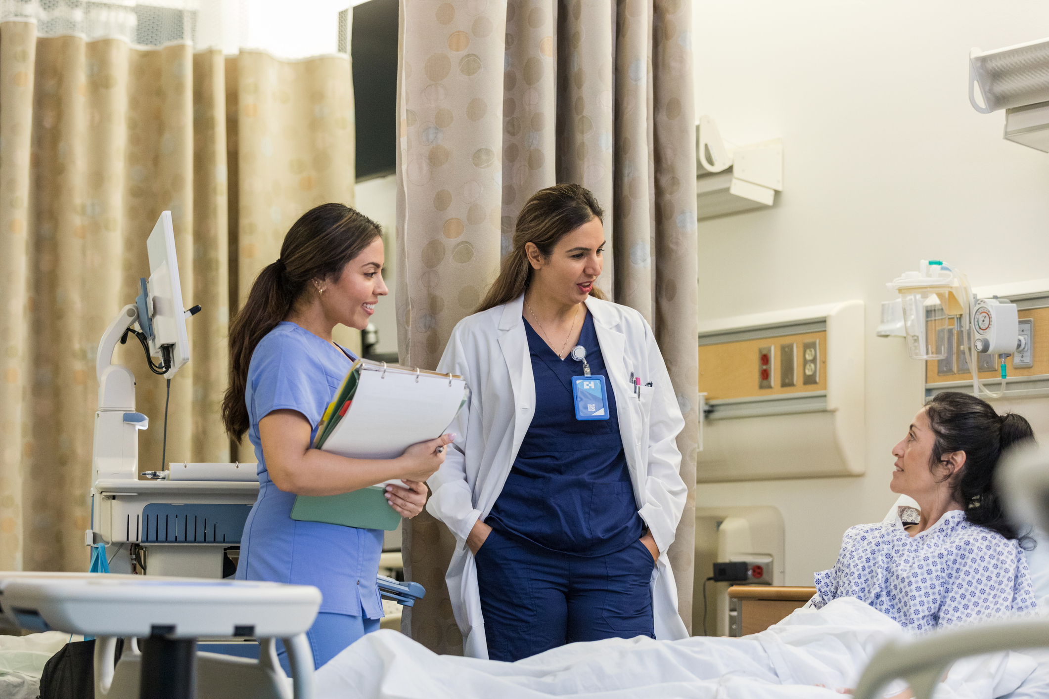 ER nurse and doctor talking to patient